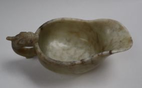 A Chinese marbled white jade jug, of archaic form,