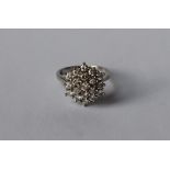 A diamond cluster ring,