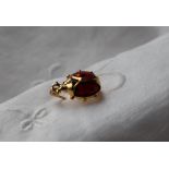 An 18ct yellow gold, red and black enamel brooch in the form of a ladybird, 20mm long,