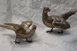A Pair of Elizabeth II silver pheasants, with cast feather decoration, import marks for London,