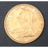 A Victorian gold sovereign dated 1893,