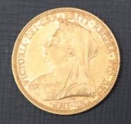 A Victorian gold sovereign dated 1893,