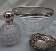 A George V silver topped scent bottle, with a domed top and a hobnail cut glass bulbous body,