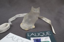 A Lalique frosted glass model of a seated cat, signed Lalique France to the base,