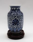 A Chinese blue and white porcelain vase, decorated with flowers and leaves,