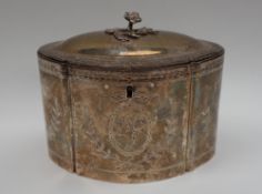 A George III white metal tea caddy, of shaped oval form, the domed hinged lid with a floral finial,