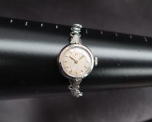 A Lady's Omega wristwatch, the silvered dial with batons,