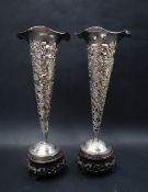 A pair of Chinese silver bud vases,