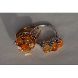 An orange opal dress ring set with six cabochon opals to a yellow metal setting marked 18k,
