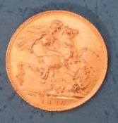 A George V gold sovereign,