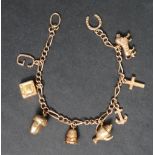 A 9ct gold charm bracelet, set with numerous charms including a letter G, television, acorn,