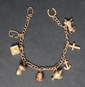 A 9ct gold charm bracelet, set with numerous charms including a letter G, television, acorn,