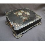 A Victorian papier mache writing slope, inlaid with mother of pearl and gilt decorated leaves,