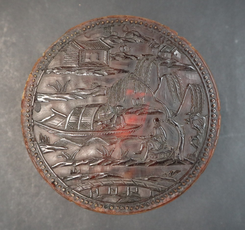 A 19th century Chinese carved tortoiseshell box and cover of circular form,