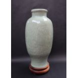 A Chinese celadon vase, of inverted baluster form decorated with flower heads and leaves,