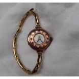 A lady's 9ct gold wristwatch, the chapter ring with blue enamel Roman numerals,