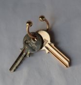 A 9ct yellow gold key,