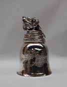 A Chinese silver bell, with a four toed dragon cast handle, the bowl engraved with a dragon,