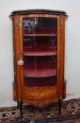 A continental kingwood vitrine, the oval shaped top above a glazed door and glazed sides,