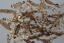 A collection of 9ct yellow gold Welsh Love Spoon pendants, approximately 57.