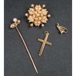 A 15ct yellow gold brooch of floral form, set with seed pearls,
