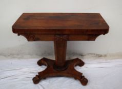 A Victorian rosewood card table, the rectangular top with rounded corners,