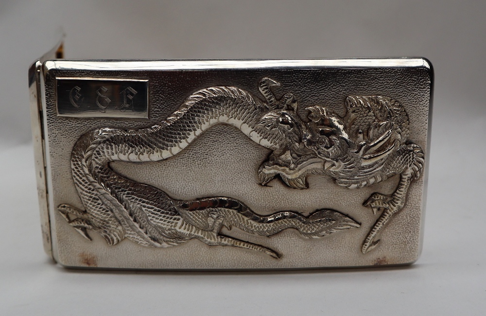 A Chinese silver cigarette case, the top decorated with a dragon and initialled, marked 90, - Image 4 of 15