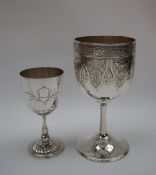 A Chinese silver goblet, of usual form decorated with a band of flowers and leaves,