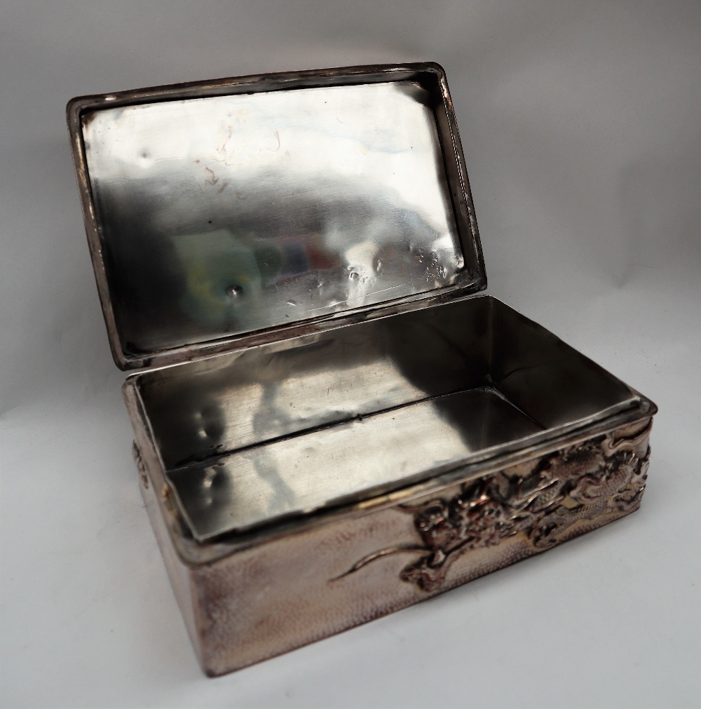 A Chinese silver cigarette case, the top decorated with a dragon and initialled, marked 90, - Image 13 of 15