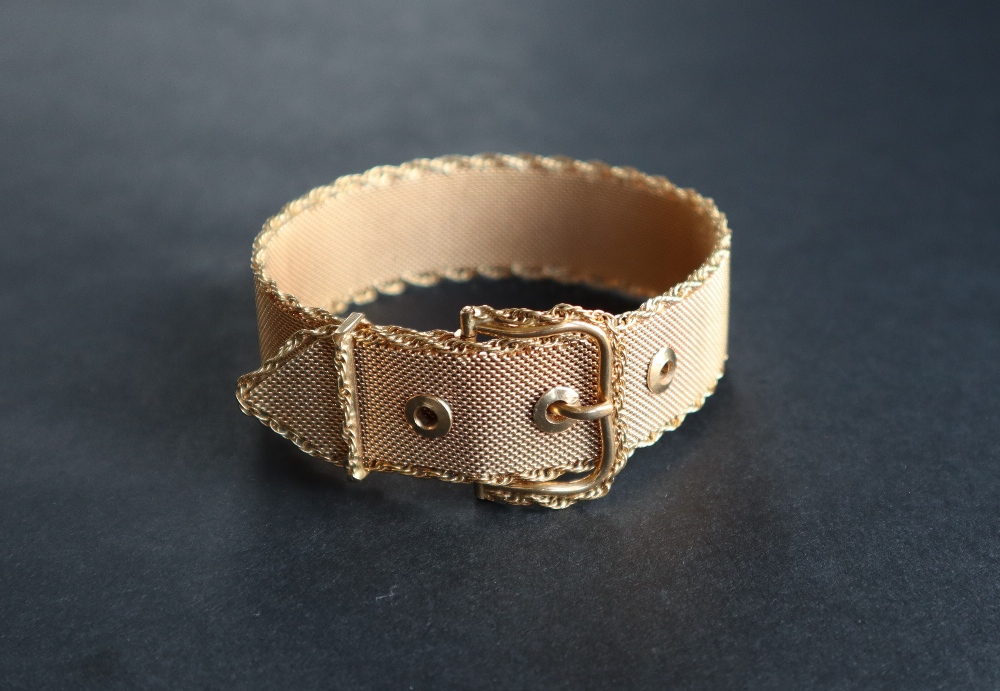 An 18ct gold bracelet in the form of a belt, of mesh form with a rope twist border,