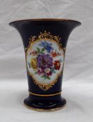 A Meissen vase of flared tapering form painted with sprays of flowers to a Royal Blue ground on a