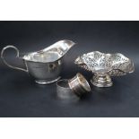 A George V silver sauce boat, of usual form ion an oval base,