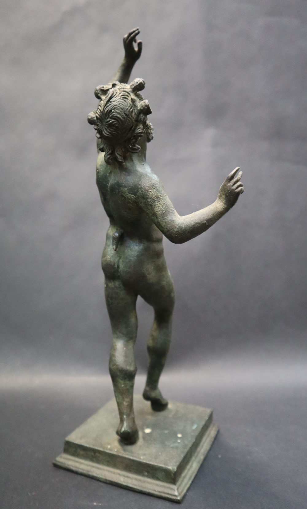 A bronze figurine of "The dancing Faun" on a stepped square base, after the antique, 31. - Image 5 of 7