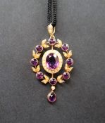 A 15ct yellow gold amethyst and seed pearl pendant,