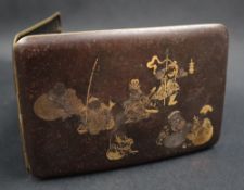 A Japanese Damascene cigarette box depicting the seven gods of fortune,