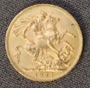 A George V gold sovereign,