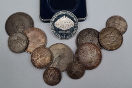 A United States One Dollar Constitution coin, cased together with two 1966 Canada Dollars,