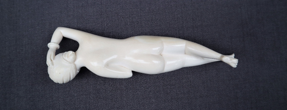 An early 20th century Japanese ivory erotica figure of a recumbent naked figure, 15. - Image 4 of 7