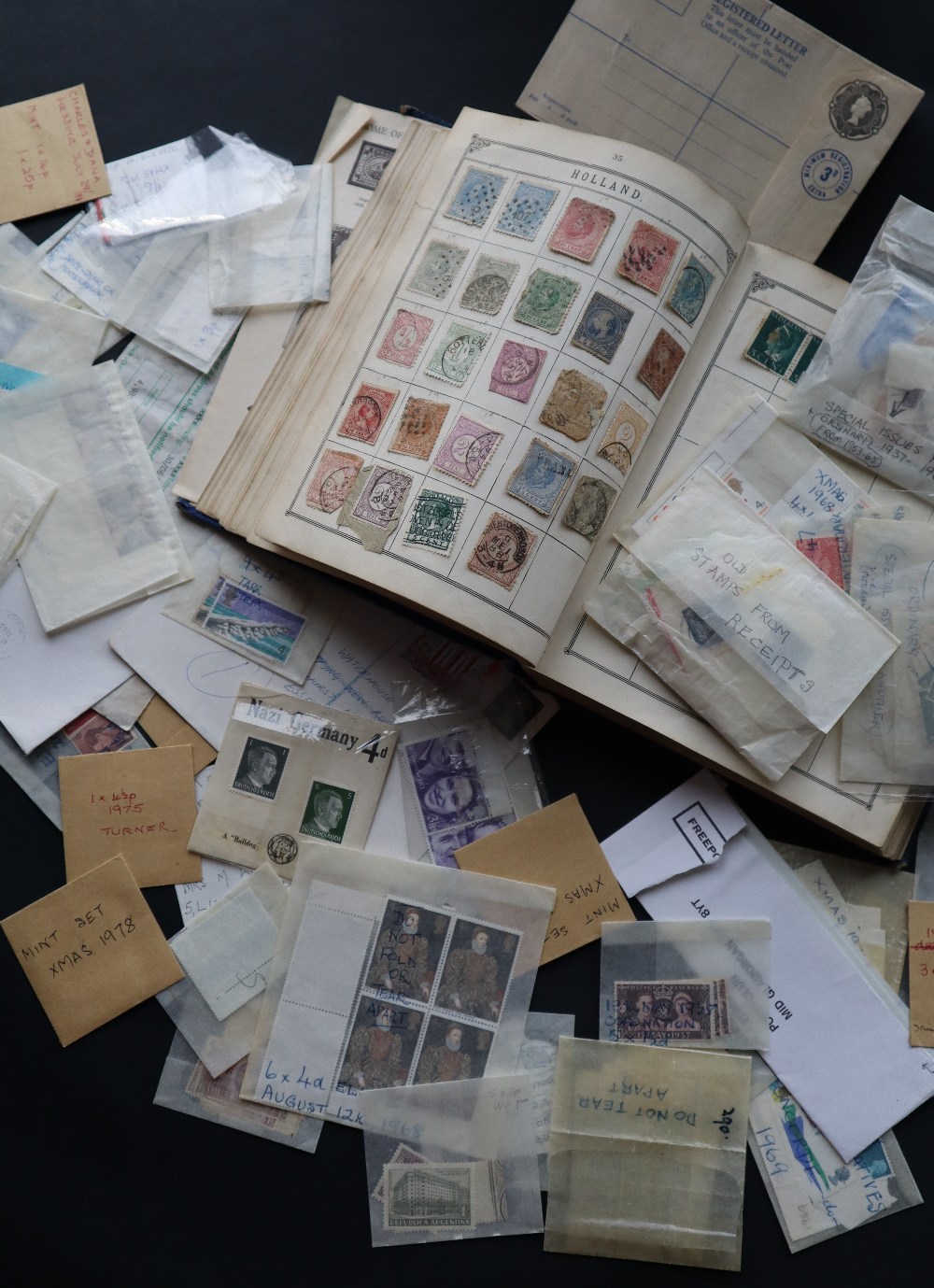 A stamp album of World stamps from Victoria onwards together with loose mint stamps