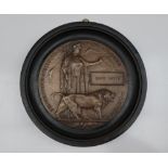 A World War I bronze Death plaque in an ebonised frame postumously awarded to "David Whyte"