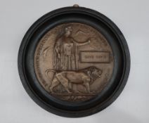A World War I bronze Death plaque in an ebonised frame postumously awarded to "David Whyte"