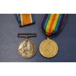 Two World War I medals, including The British War Medal and The Victory medal,