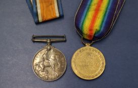 Two World War I medals, including The British War Medal and The Victory medal,