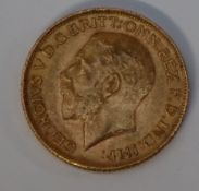 A George V gold sovereign,