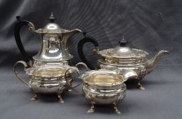 A George V silver four piece tea set, comprising a hot water pot, tea pot,