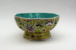 A Chinese famille jaune porcelain pedestal bowl,