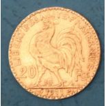 A gold 20 Francs Rooster coin,