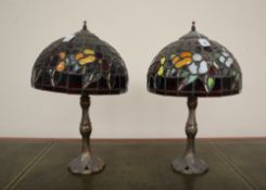 A pair of "Tiffa-Mini" Tiffany style table lamps with domed multicoloured leaded glass shades on