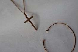 A 9ct yellow gold chain together with a 9ct yellow gold cross and a 9 ct bangle, approximately 8.