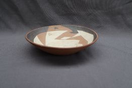 John B McLellan - A studio pottery bowl, with abstract and hand decoration in black,